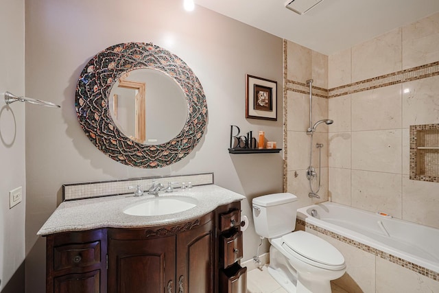 full bath with vanity, toilet, and tiled shower / bath combo