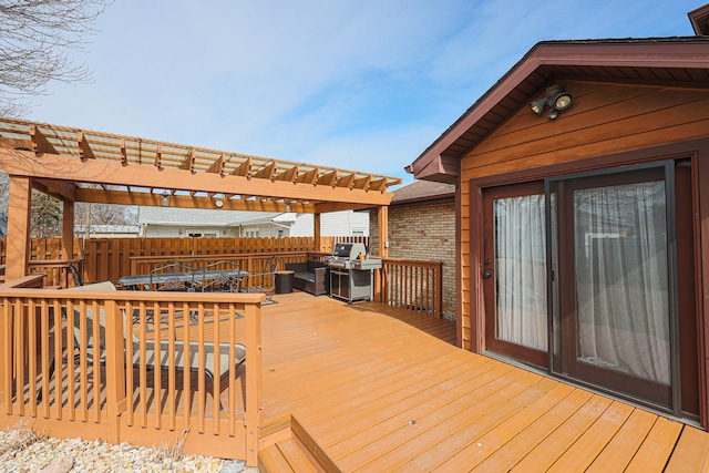 deck with fence, area for grilling, outdoor dining space, and a pergola