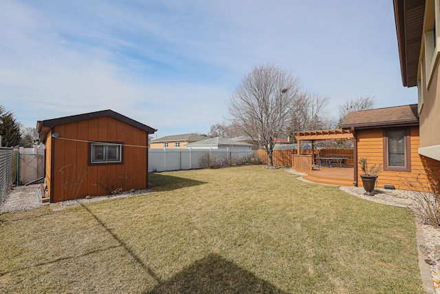 view of yard with an outdoor structure, a fenced backyard, a shed, and a pergola