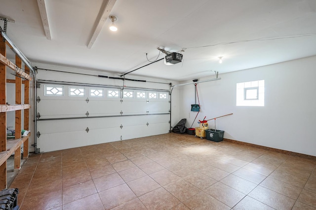 garage featuring baseboards and a garage door opener