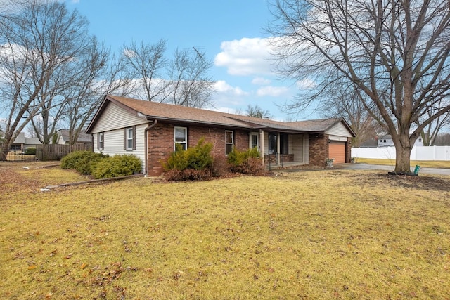 ranch-style house featuring driveway, brick siding, an attached garage, fence, and a front yard