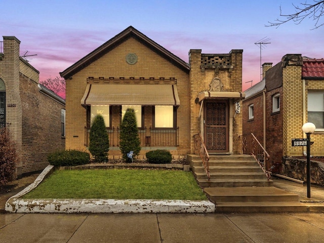 view of front of property featuring brick siding