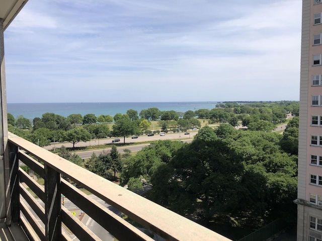 balcony featuring a water view