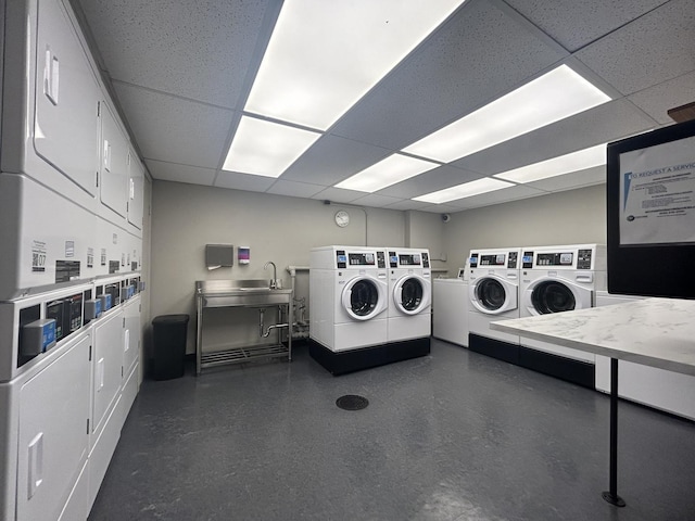 common laundry area with washer and clothes dryer and stacked washing maching and dryer