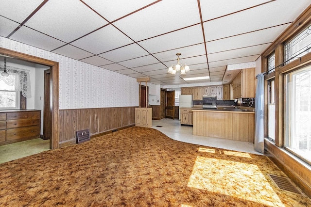 619 Lincoln St, Minonk, IL 61760 - kitchen featuring wallpapered walls, a paneled ceiling, visible vents, and wainscoting
