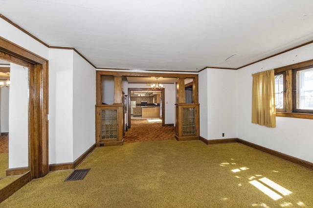 619 Lincoln St, Minonk, IL 61760 - carpeted empty room with ornamental molding, baseboards, visible vents, and a chandelier