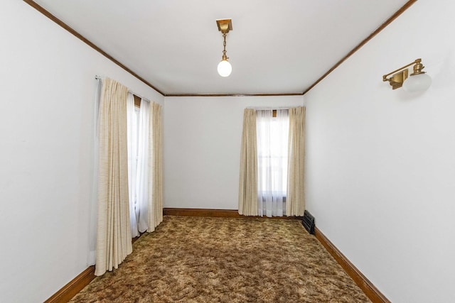 619 Lincoln St, Minonk, IL 61760 - carpeted spare room featuring visible vents, baseboards, and ornamental molding