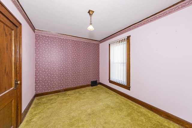 619 Lincoln St, Minonk, IL 61760 - spare room featuring wallpapered walls, baseboards, visible vents, and ornamental molding