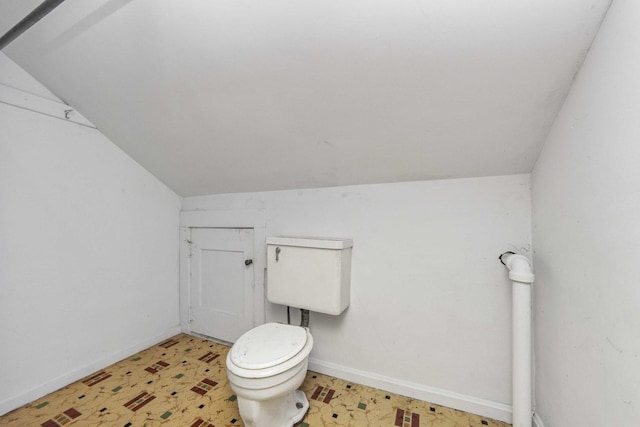 619 Lincoln St, Minonk, IL 61760 - bathroom featuring tile patterned floors, toilet, baseboards, and lofted ceiling