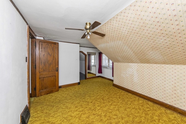 619 Lincoln St, Minonk, IL 61760 - additional living space with a ceiling fan, carpet, wallpapered walls, baseboards, and vaulted ceiling