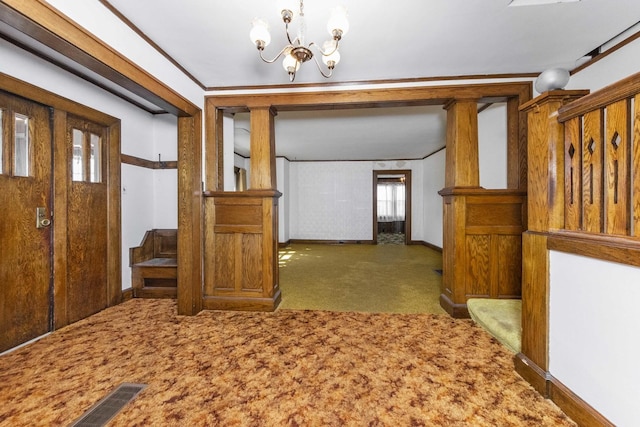 619 Lincoln St, Minonk, IL 61760 - carpeted foyer entrance featuring a notable chandelier, crown molding, and baseboards