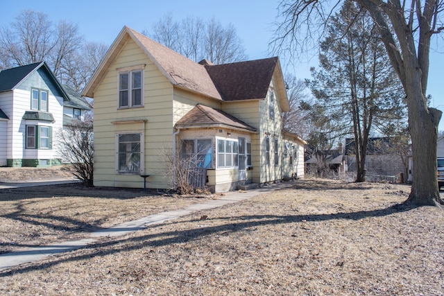 view of front of house with a shingled roof