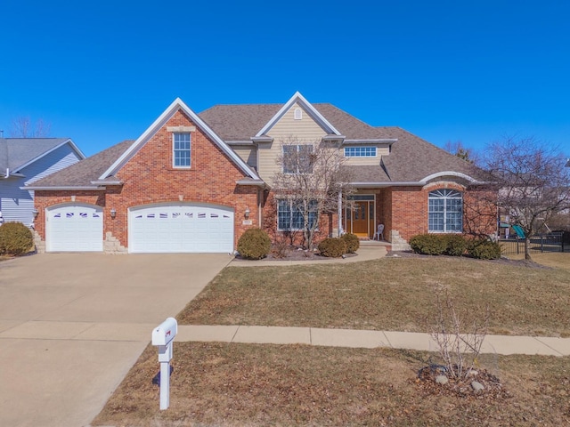 view of front of house with roof with shingles, a front lawn, concrete driveway, and brick siding