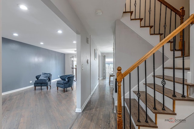 interior space featuring stairway, baseboards, wood finished floors, and recessed lighting