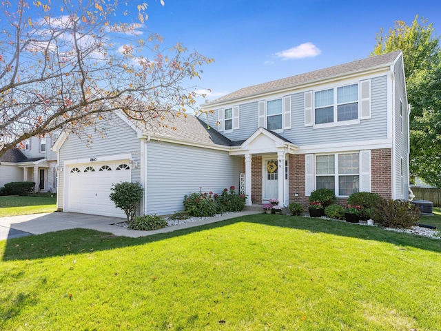 view of front of home featuring brick siding, an attached garage, driveway, and a front yard