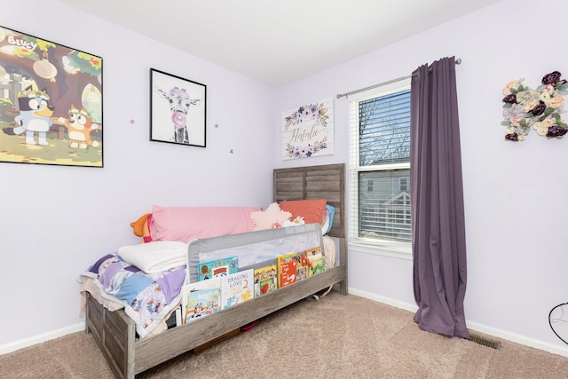 bedroom featuring visible vents, baseboards, and carpet floors