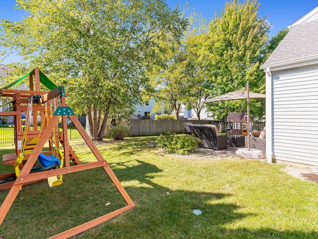 view of yard with a playground and a fenced backyard