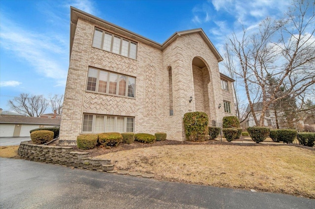 view of front of home featuring brick siding