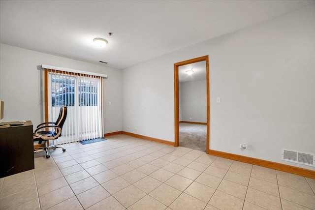 office featuring visible vents, baseboards, and light tile patterned floors