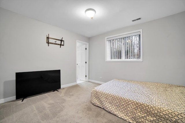 bedroom with carpet flooring, visible vents, and baseboards