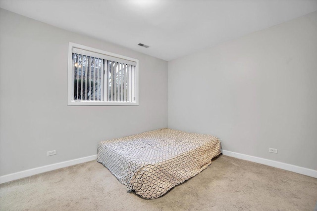 bedroom featuring carpet, visible vents, and baseboards