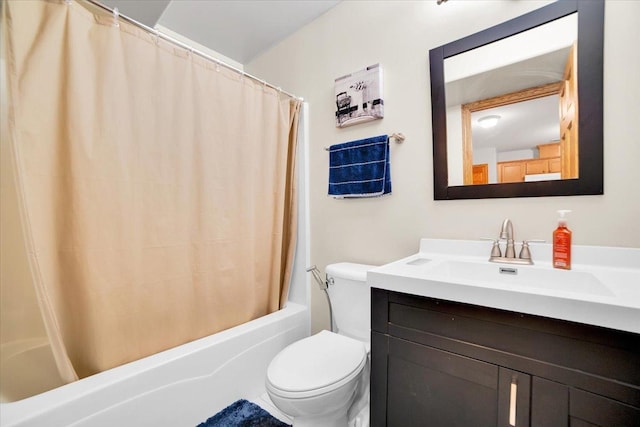 full bath with vanity, toilet, and shower / bath combo with shower curtain