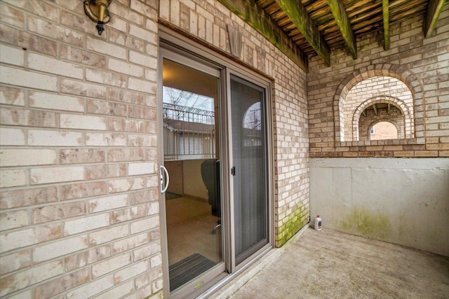 entrance to property with brick siding