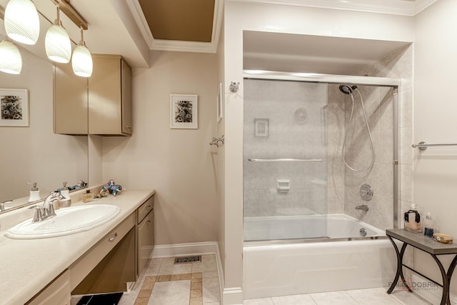 bathroom featuring enclosed tub / shower combo, crown molding, tile patterned flooring, baseboards, and vanity