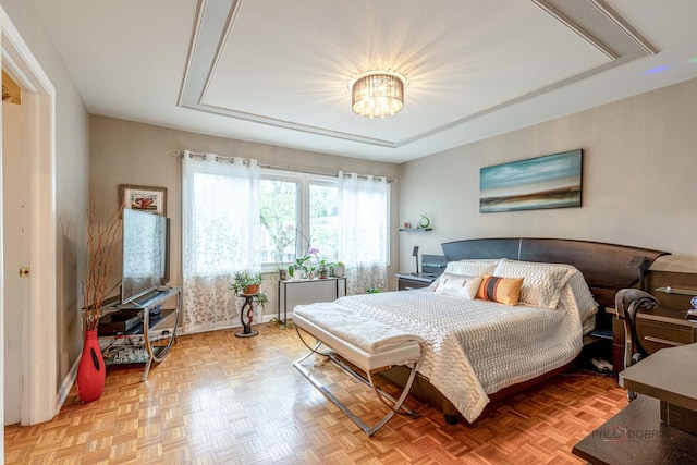 bedroom featuring baseboards and a notable chandelier