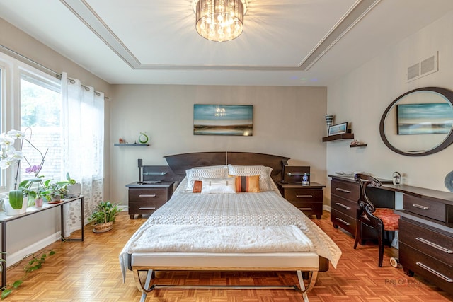 bedroom featuring an inviting chandelier, baseboards, and visible vents