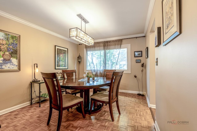 dining area featuring baseboards and ornamental molding