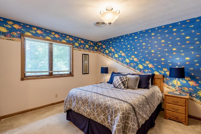 bedroom with visible vents, baseboards, and carpet