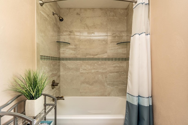 bathroom with shower / bath combination with curtain