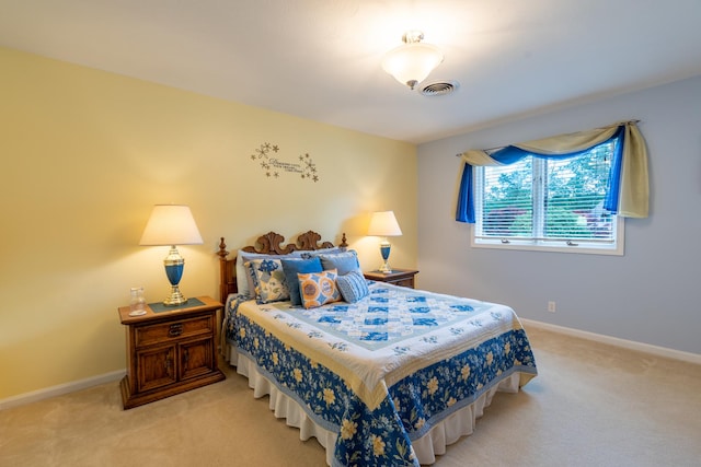 carpeted bedroom with baseboards and visible vents