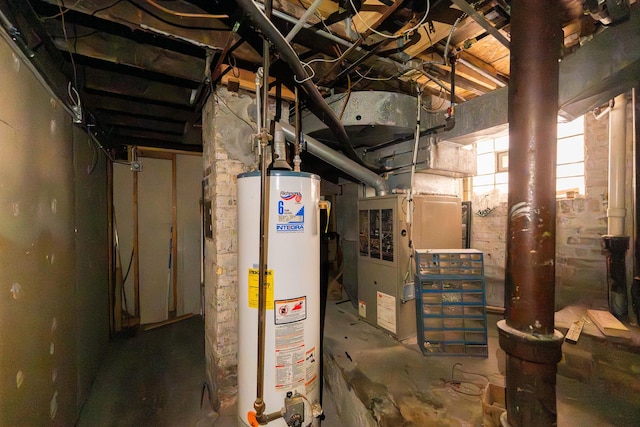 utility room featuring water heater