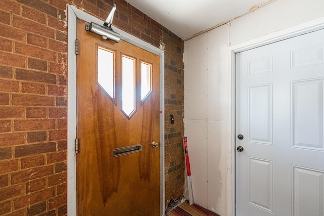 doorway to outside with brick wall