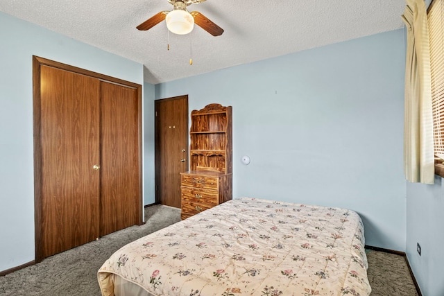 bedroom with carpet floors, a textured ceiling, baseboards, and a closet