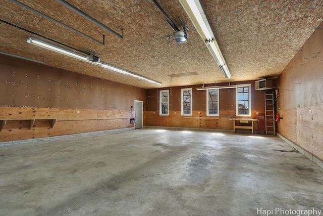 garage with a wall mounted air conditioner