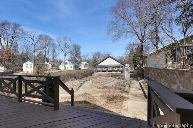 wooden deck with a residential view