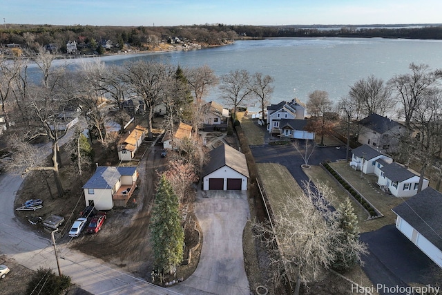 birds eye view of property with a water view and a residential view