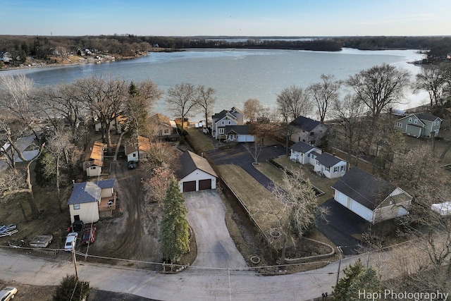 drone / aerial view with a residential view and a water view