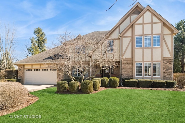 english style home with stucco siding, driveway, a front lawn, an attached garage, and brick siding