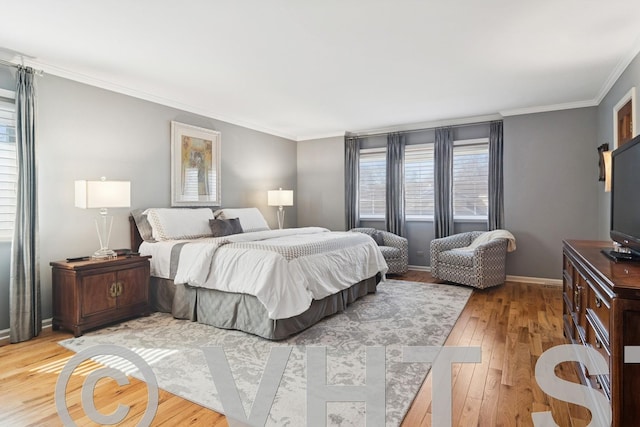 bedroom with baseboards, ornamental molding, and light wood finished floors