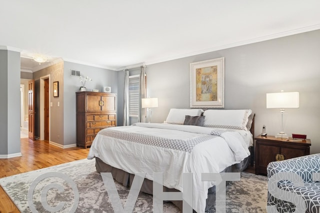 bedroom featuring baseboards, light wood-style flooring, and ornamental molding