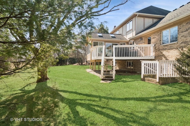 view of yard featuring a wooden deck and stairs