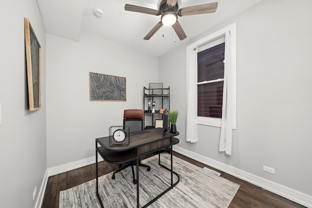 office area featuring ceiling fan, baseboards, and wood finished floors