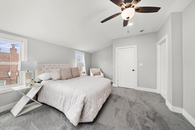 bedroom featuring lofted ceiling, carpet, baseboards, and a ceiling fan