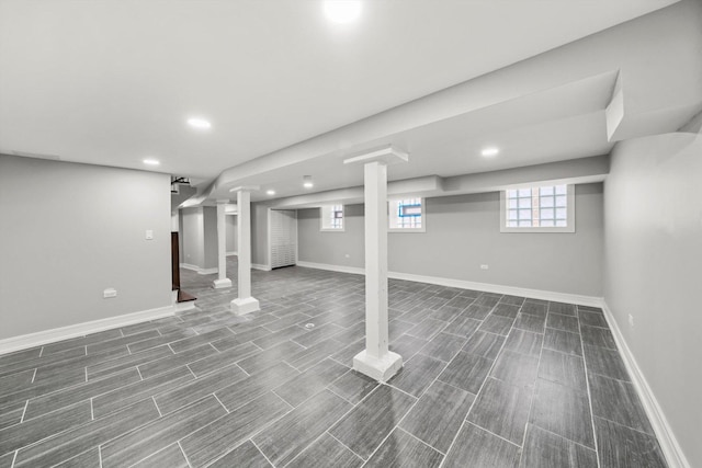 basement featuring wood finish floors, recessed lighting, and baseboards