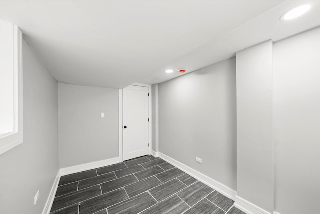 finished basement featuring recessed lighting and baseboards