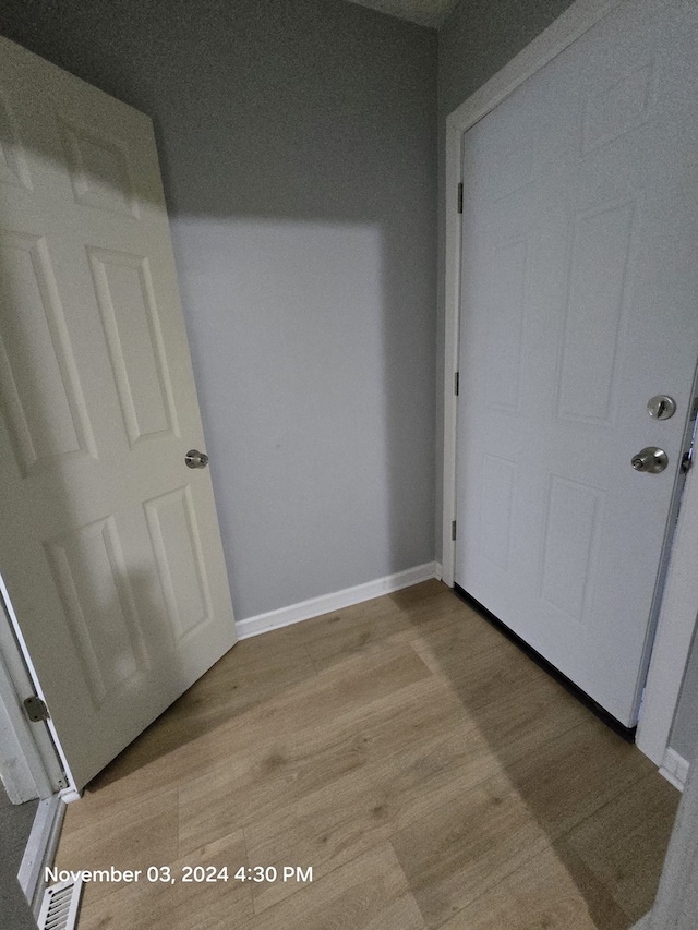 interior space with light wood-style flooring and baseboards